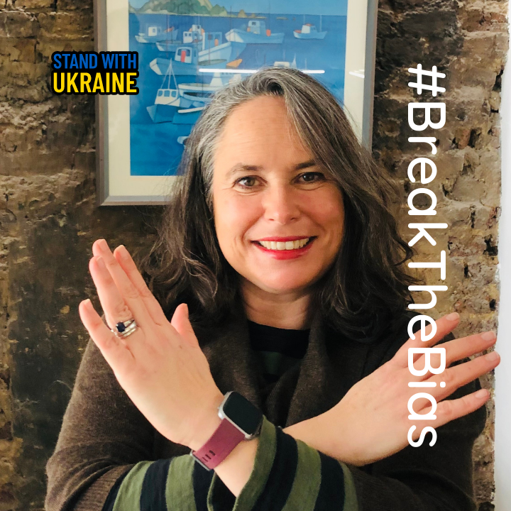 our director Sarah Green with crossed arms to signify 'breaking the bias' which is the theme for International Women's Day 2022